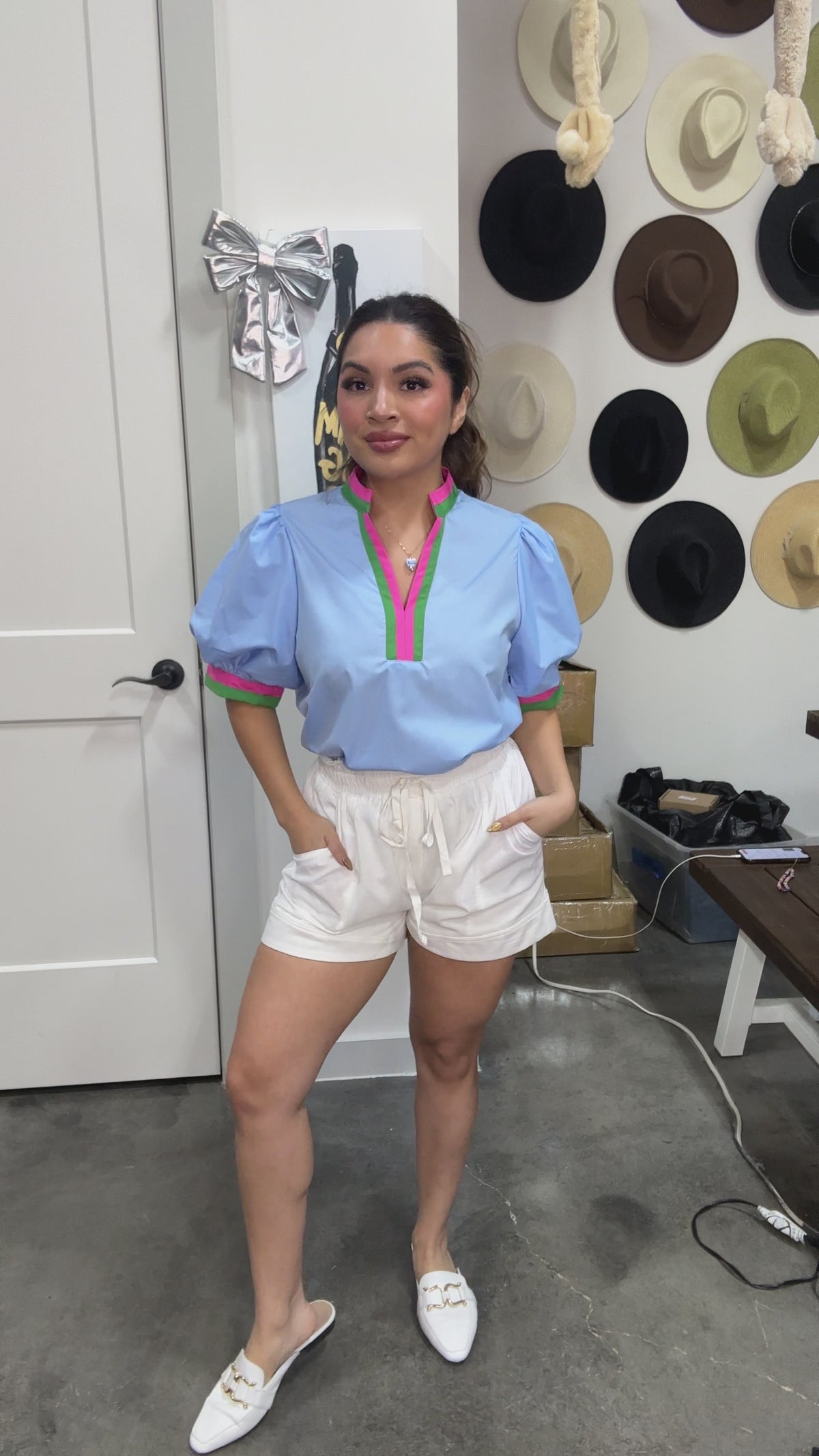 Kindness Counts Top in Chambray or light blue on a Brunette Model | She is also wearing white shorts Southern House Clothing