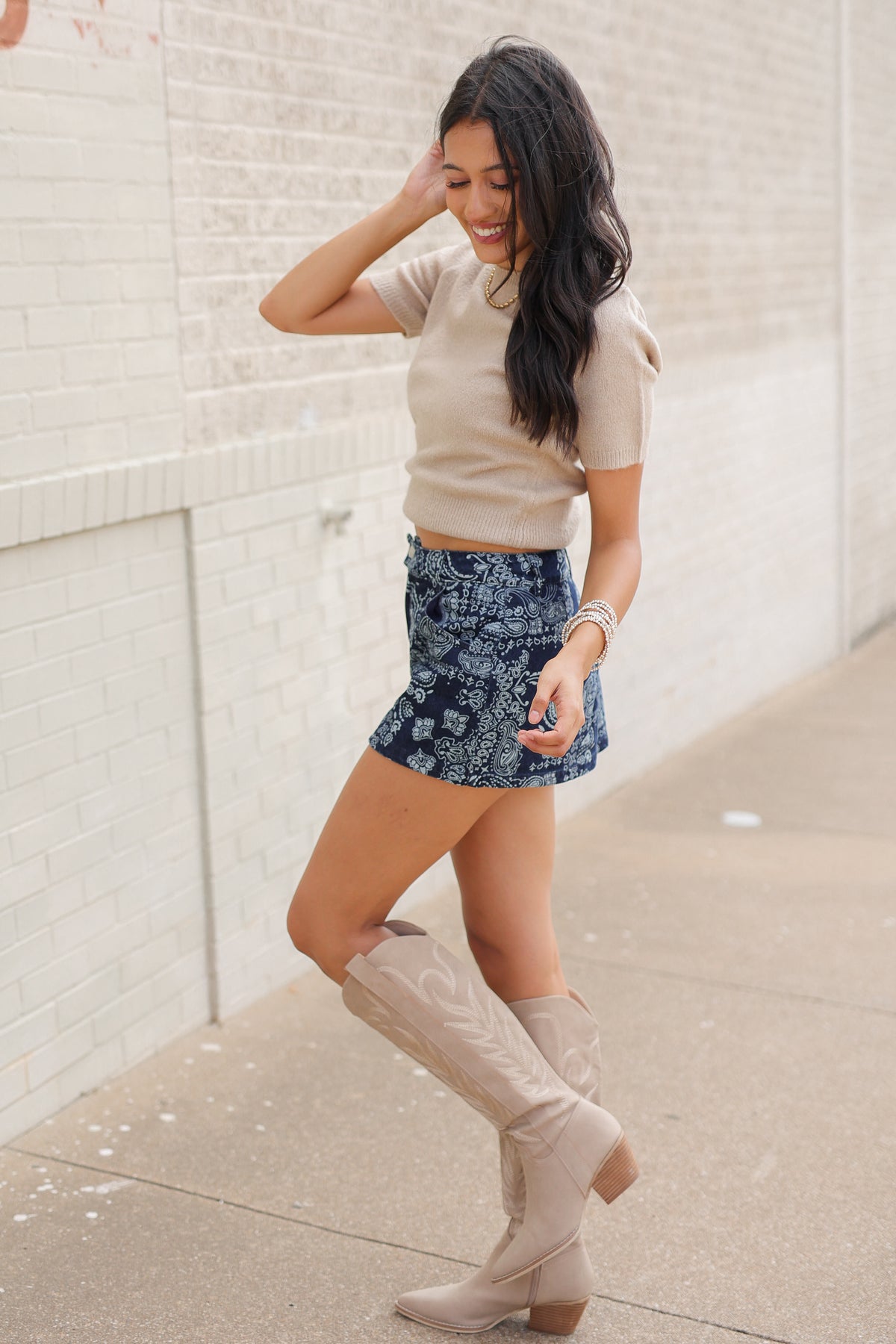 Lantana Knit Sweater Top in oatmeal styled with high-waisted Bandera Paisley Denim Shorts featuring a western-inspired bandana pattern. Southern House Clothing