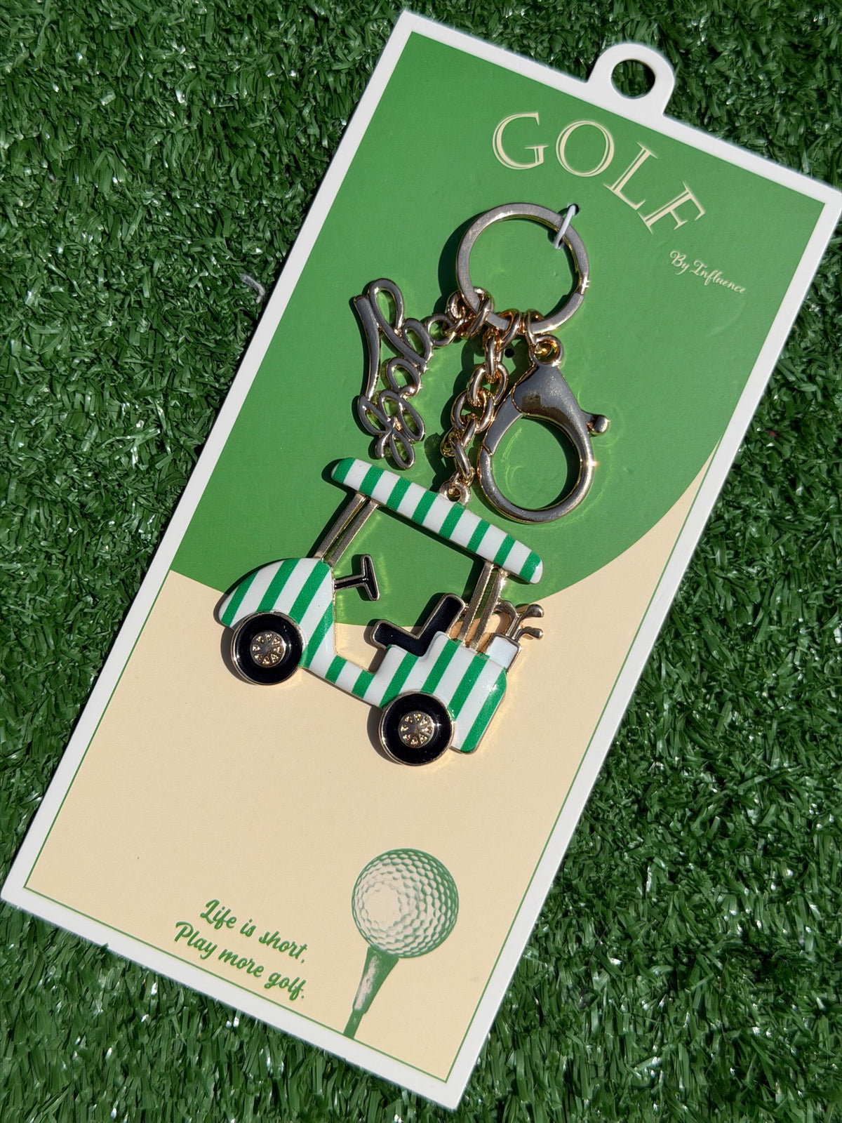 Golf-themed keychain set on a green and beige card with golf cart and golf ball illustration.