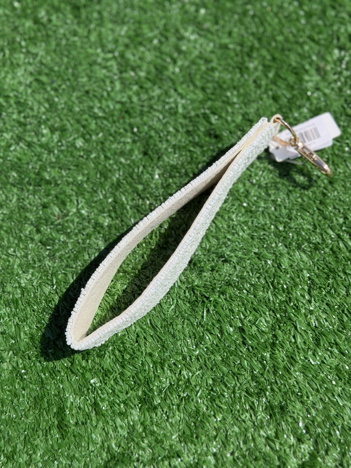 White dog leash on a green grass background