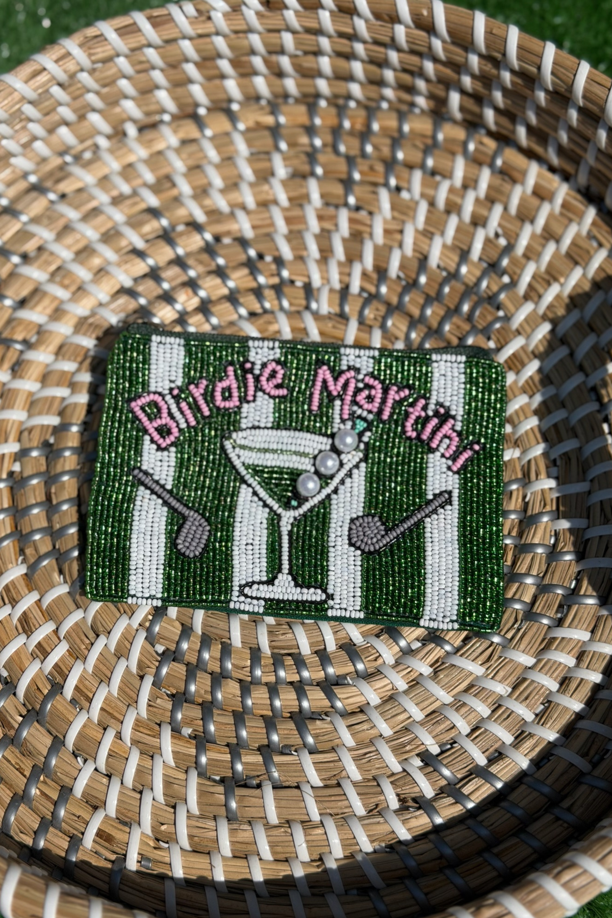 Decorative coaster with 'Birdie Martini' design on a woven surface