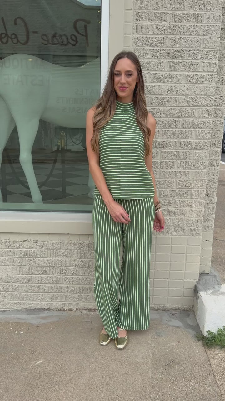 Blonde model wearing a green striped set outdoors. Southern House Clothing