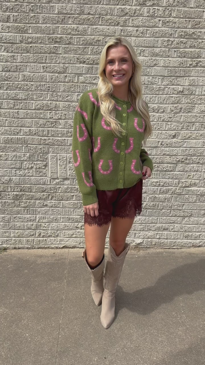 Model wearing the Blair Lace Shorts chocolate brown lace-trim shorts and brown Samara Cowboy boots. Standing outside. Southern House Clothing