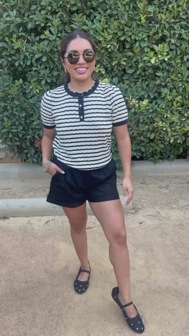 Brunette woman wearing a striped puff sleeve top from Southern House Clothing. 