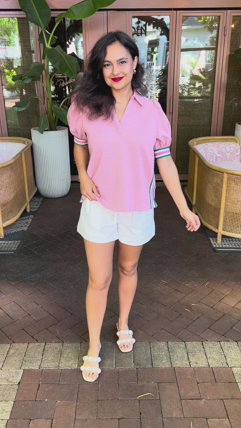 Pink Match Point Top worn by a brunette model in an outdoor setting | Southern House Clothing