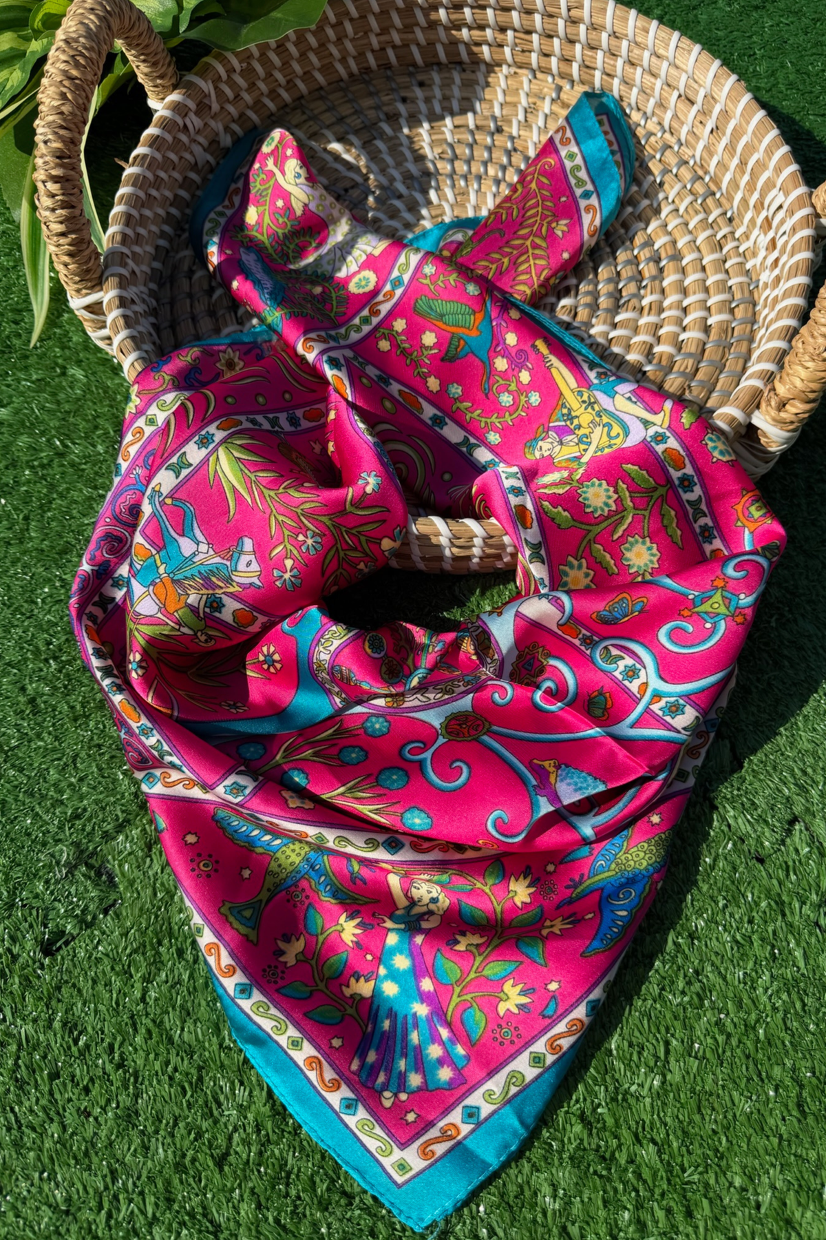 Colorful patterned scarf in a woven basket.