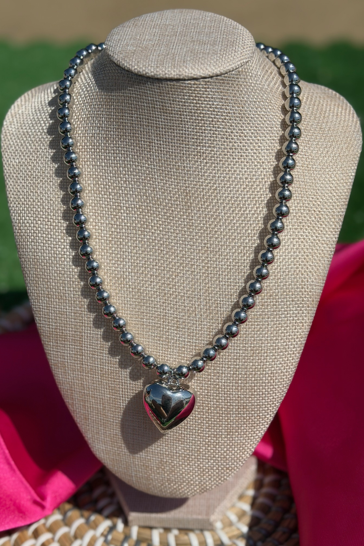 Necklace with a heart pendant on a mannequin bust